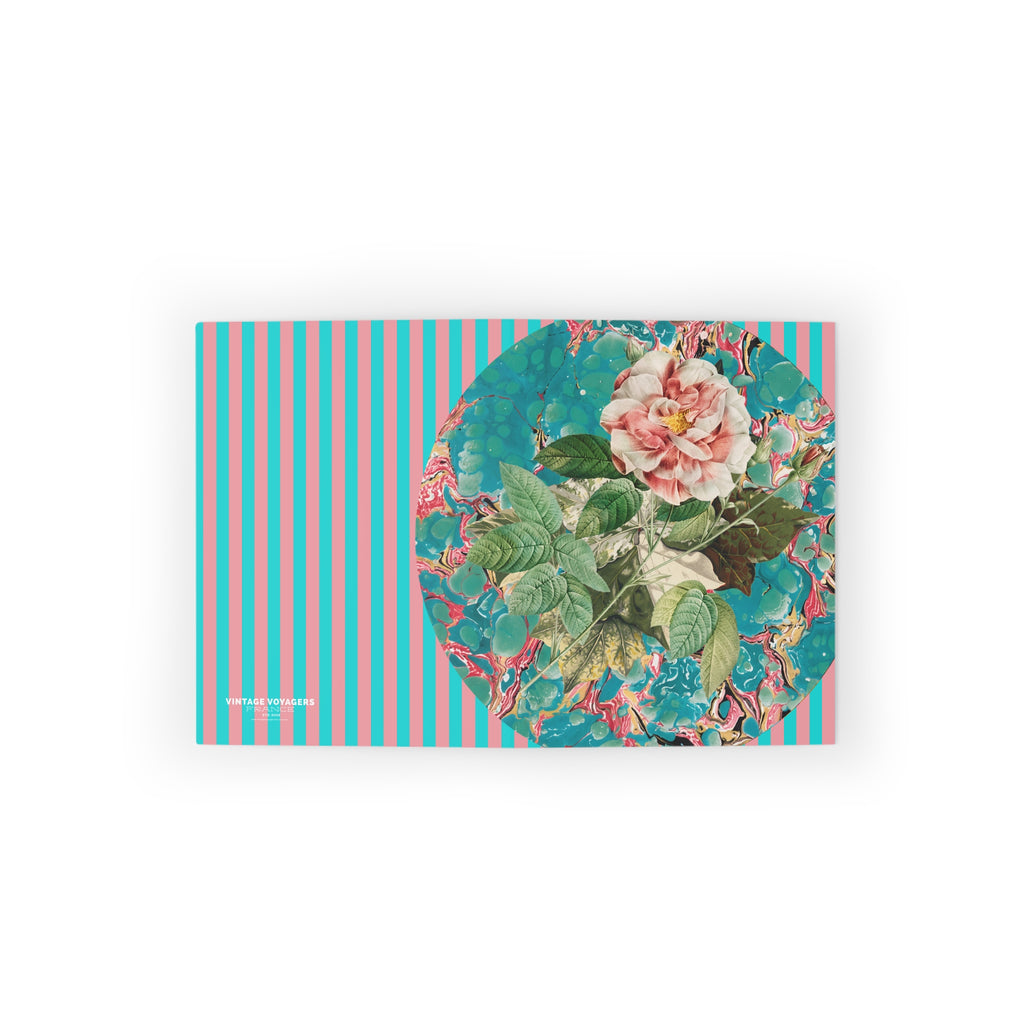 Notebook with floral design on a striped cover against a white background