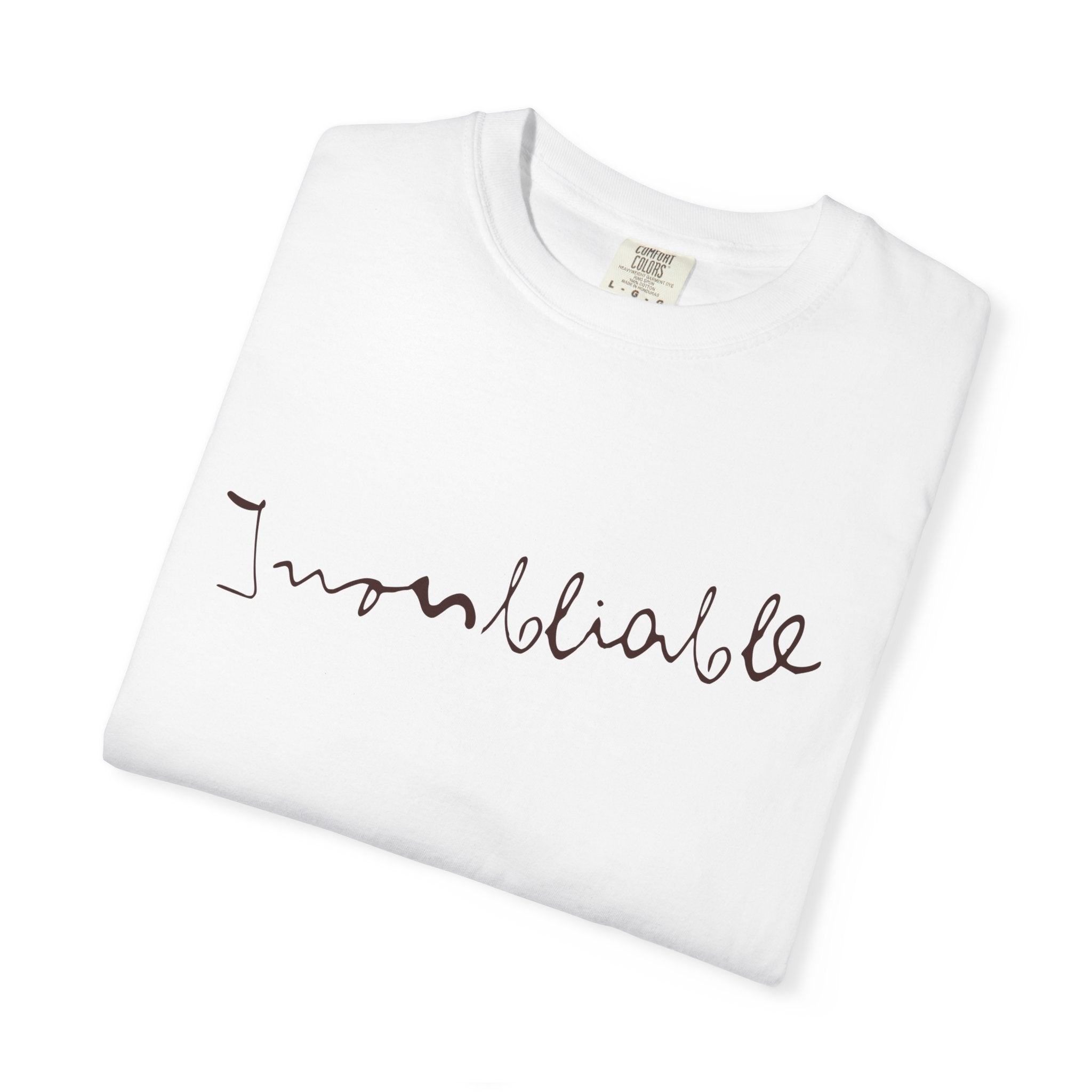 White t-shirt with 'Inoubliable' text on a white background