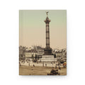 Vintage-style photograph of a city square with a tall column and statue, surrounded by buildings and people.