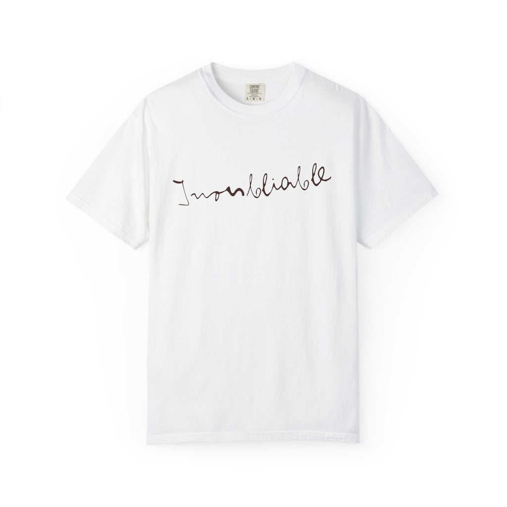 White t-shirt with 'Inoubliable—Unforgettable' text on a white background