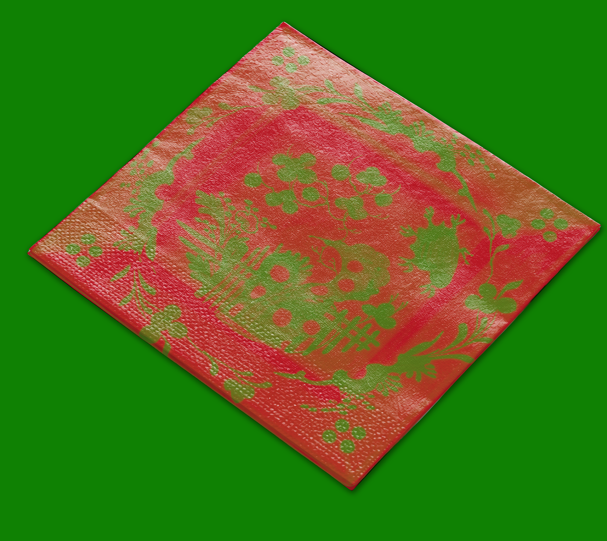 La Chinoiserie Noël cocktail napkin on a green ground — green garden scene on lacquer red