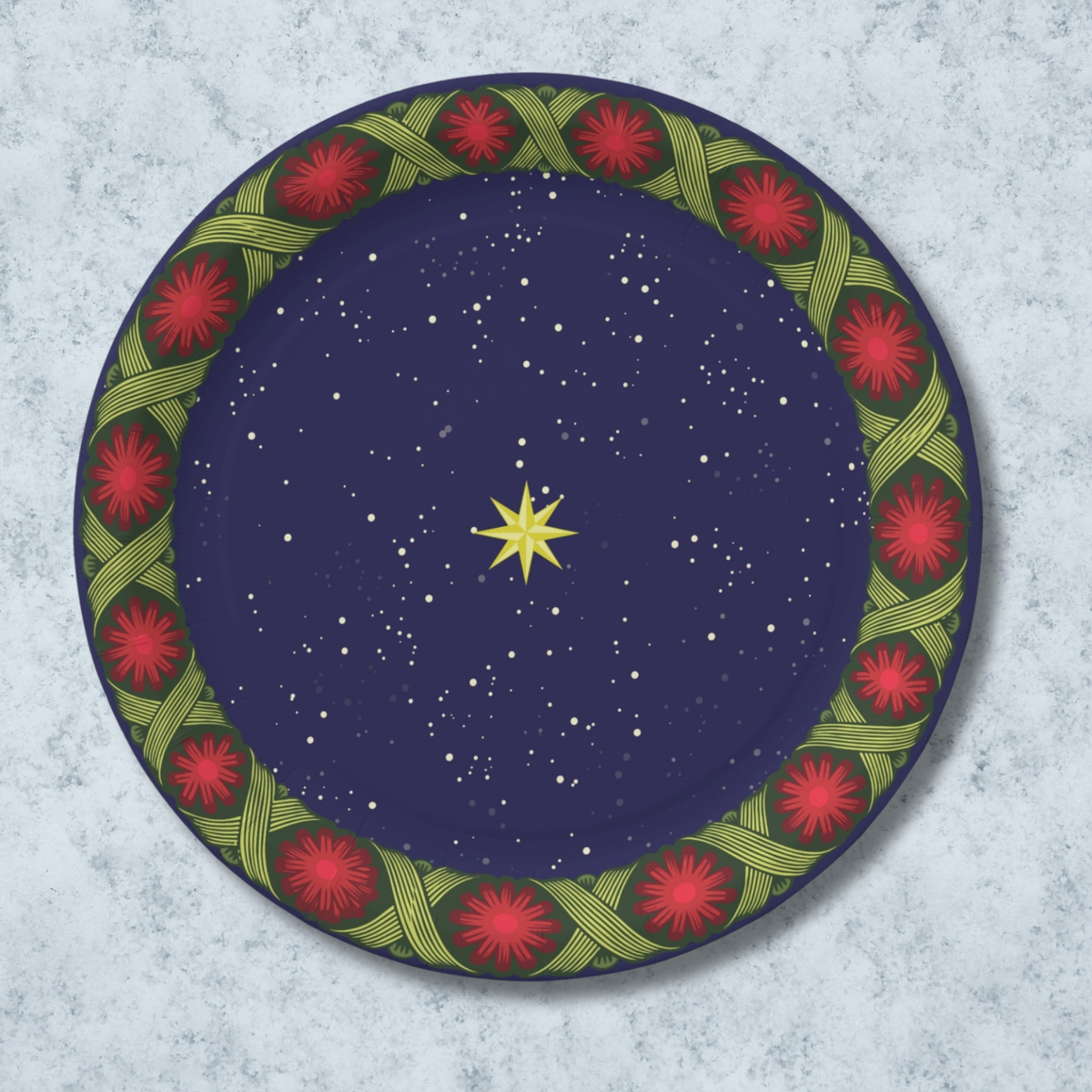 Noël La Tresse 9″ dinner plate — gold star on a navy night sky inside a braided green band with red rosettes