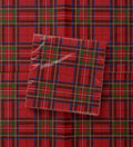 Noël Le Tartan paper napkins — red tartan with green blocks and a blue over-check, printed edge to edge