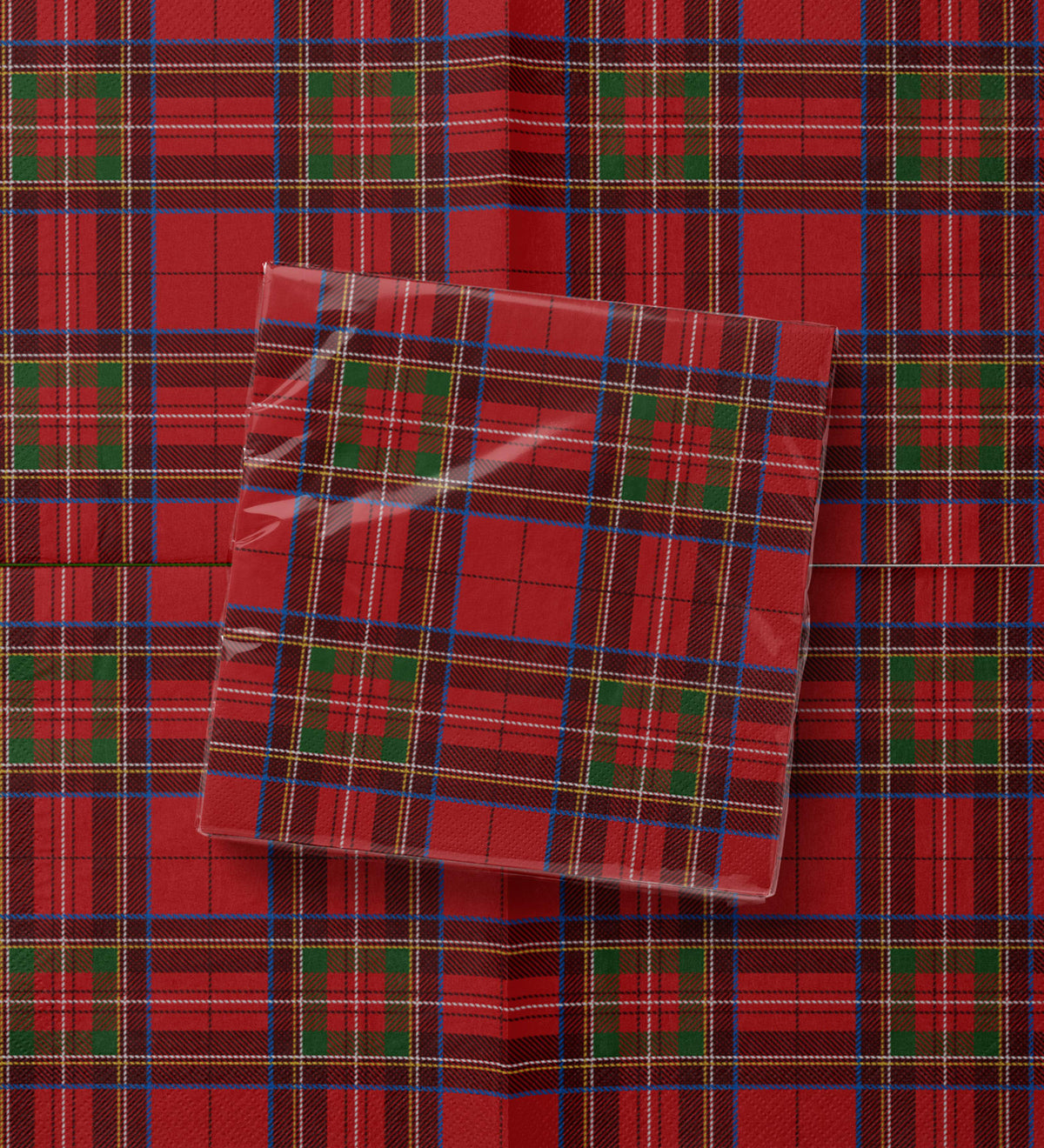 Noël Le Tartan paper napkins — red tartan with green blocks and a blue over-check, printed edge to edge