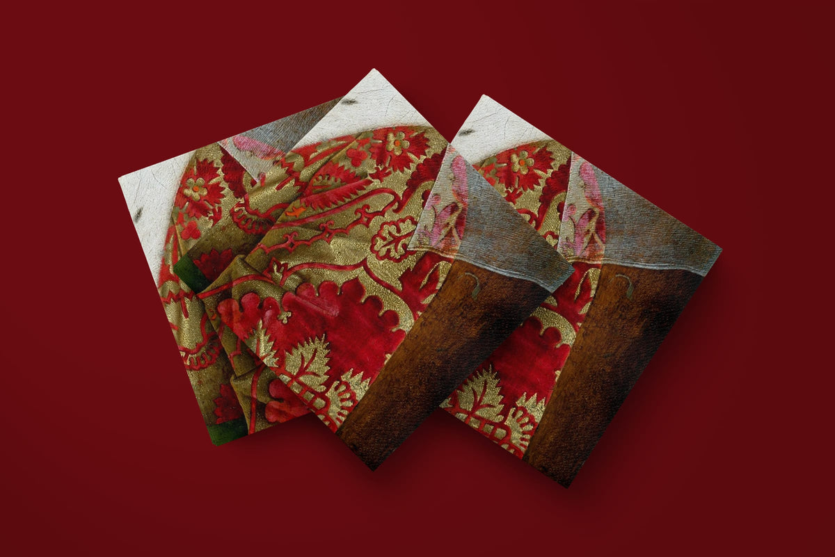Noël Le Brocart paper napkins on a deep red ground — three napkins scattered