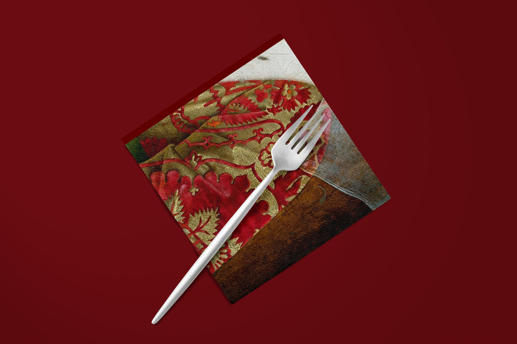 Noël Le Brocart paper napkins on a deep red ground — a napkin with a fork