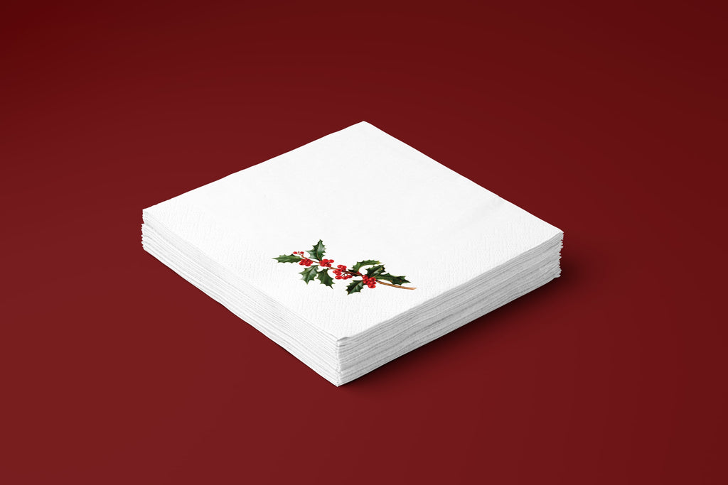 Noël Holly paper napkins on a deep red ground — a stack of napkins