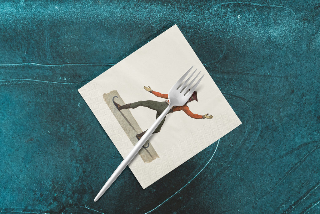 Noël L'Aplomb paper napkins on skating-rink ice — a napkin with a fork