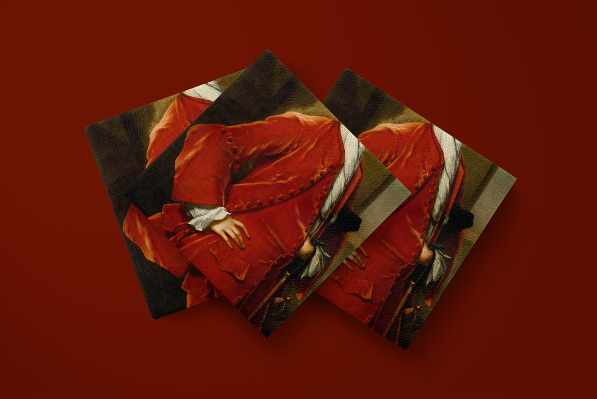Noël L'Habit Rouge paper napkins on a deep red ground — three napkins scattered