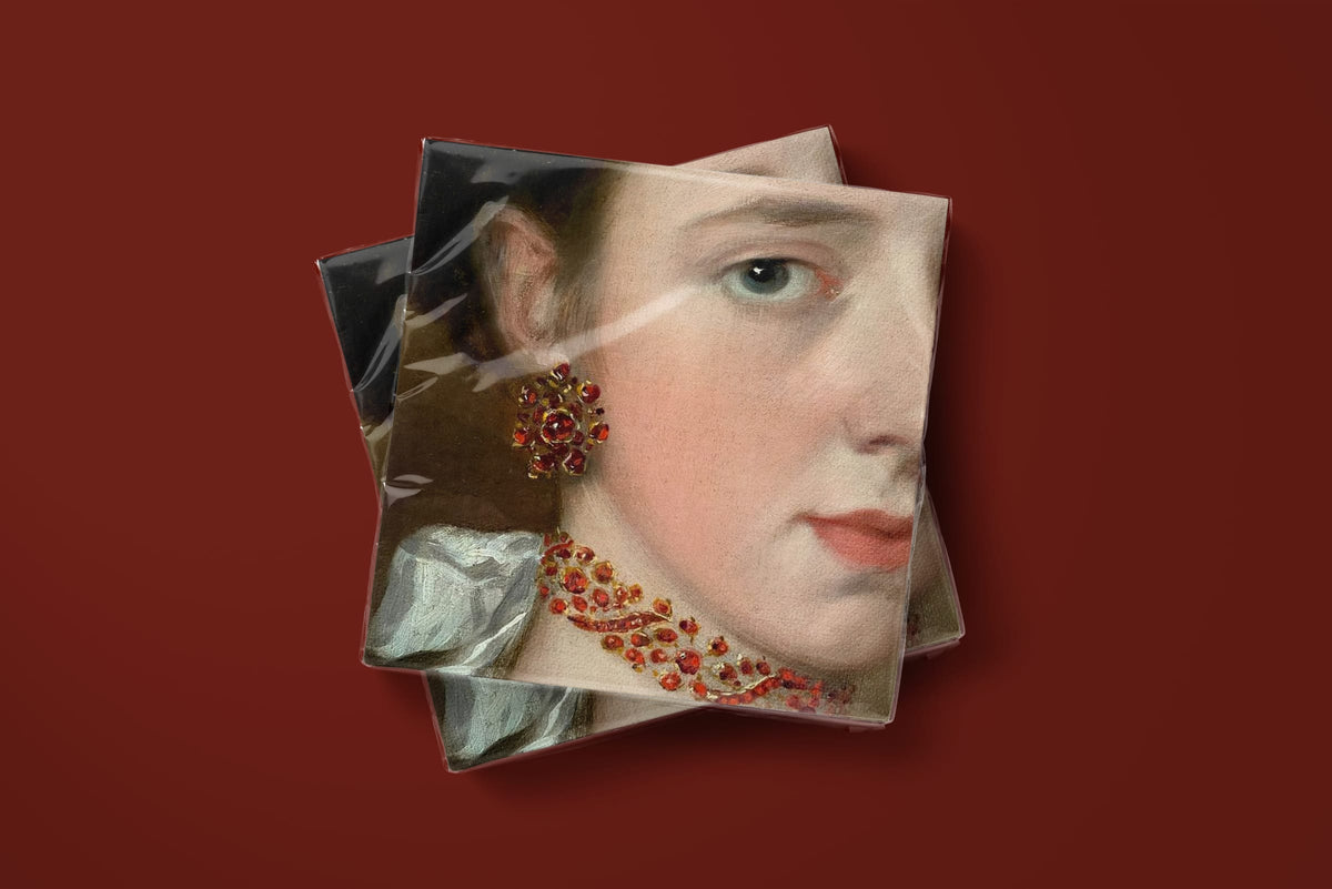 Noël La Parure paper napkins on a deep red ground — two napkins stacked