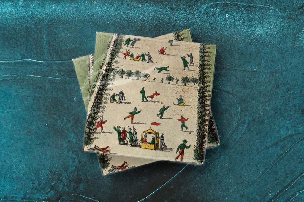 Noël La Patinoire paper napkins on skating-rink ice — two napkins stacked