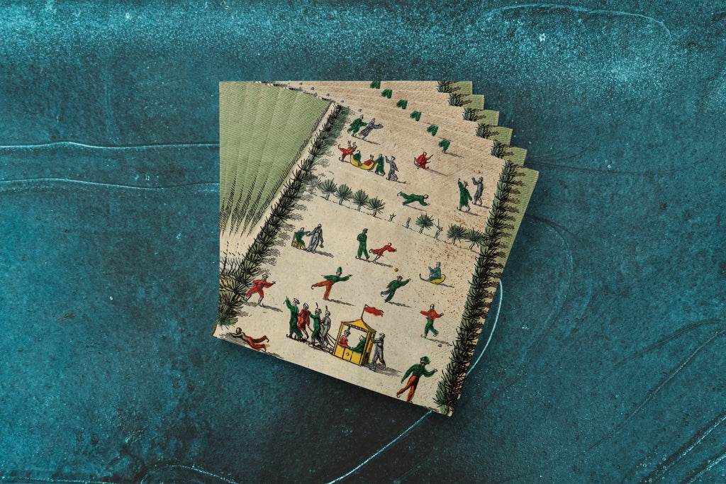 Noël La Patinoire paper napkins on skating-rink ice — a fanned stack