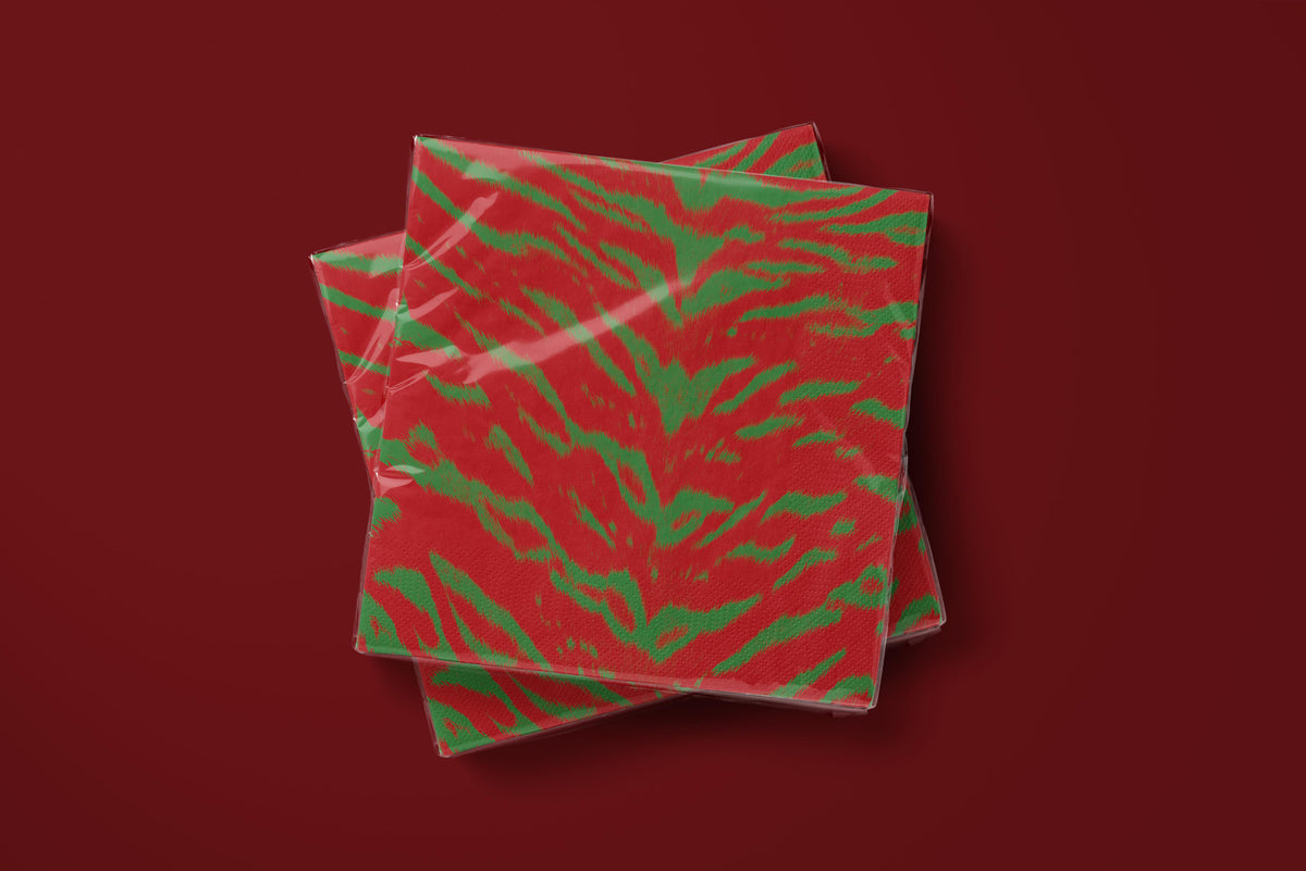 Noël Le Tigre paper napkins on a deep red ground — two napkins stacked
