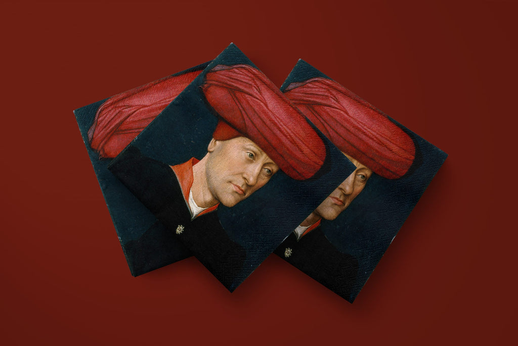 Noël Le Turban paper napkins on a deep red ground — three napkins scattered