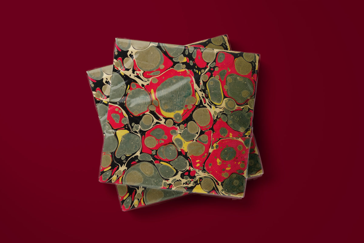 Noël Marbré Rouge paper napkins on a deep red ground — two napkins stacked