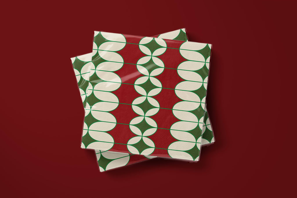 Noël Mod paper napkins on a deep red ground — two napkins stacked