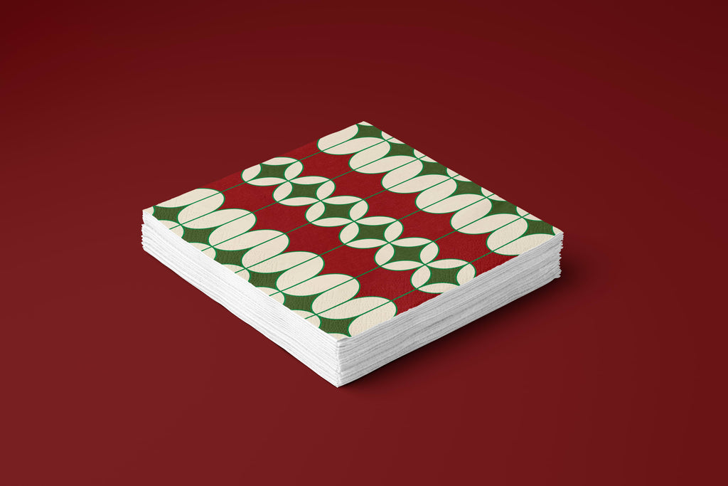 Noël Mod paper napkins on a deep red ground — a stack of napkins