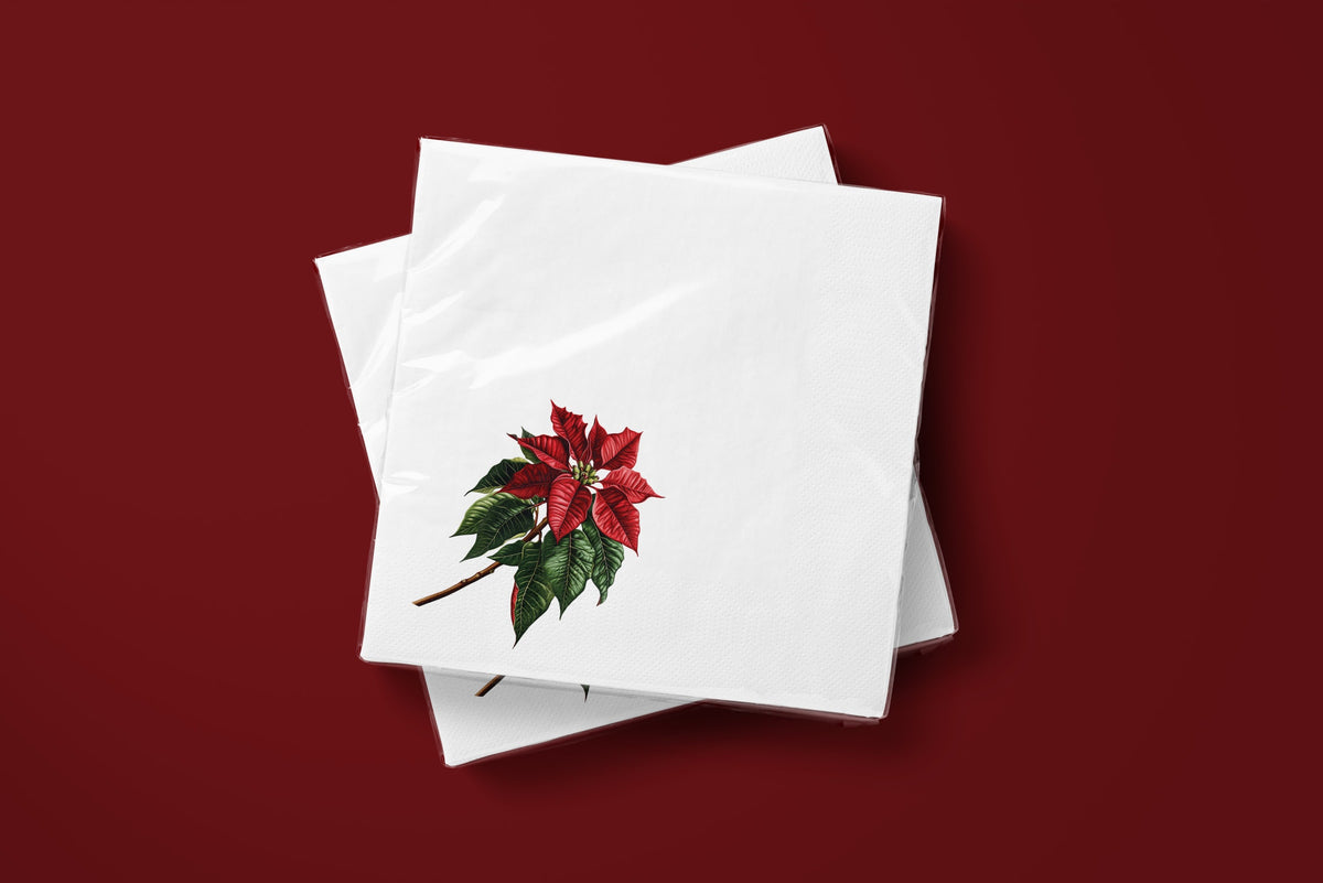 Noël Poinsettia paper napkins on a deep red ground — two napkins stacked