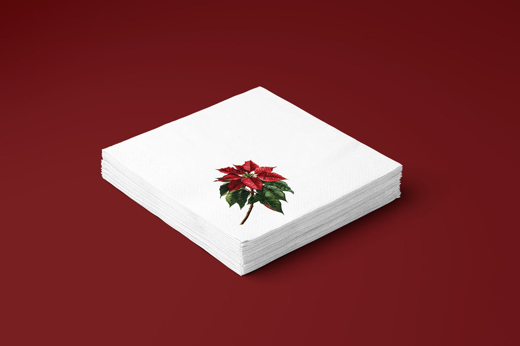 Noël Poinsettia paper napkins on a deep red ground — a stack of napkins