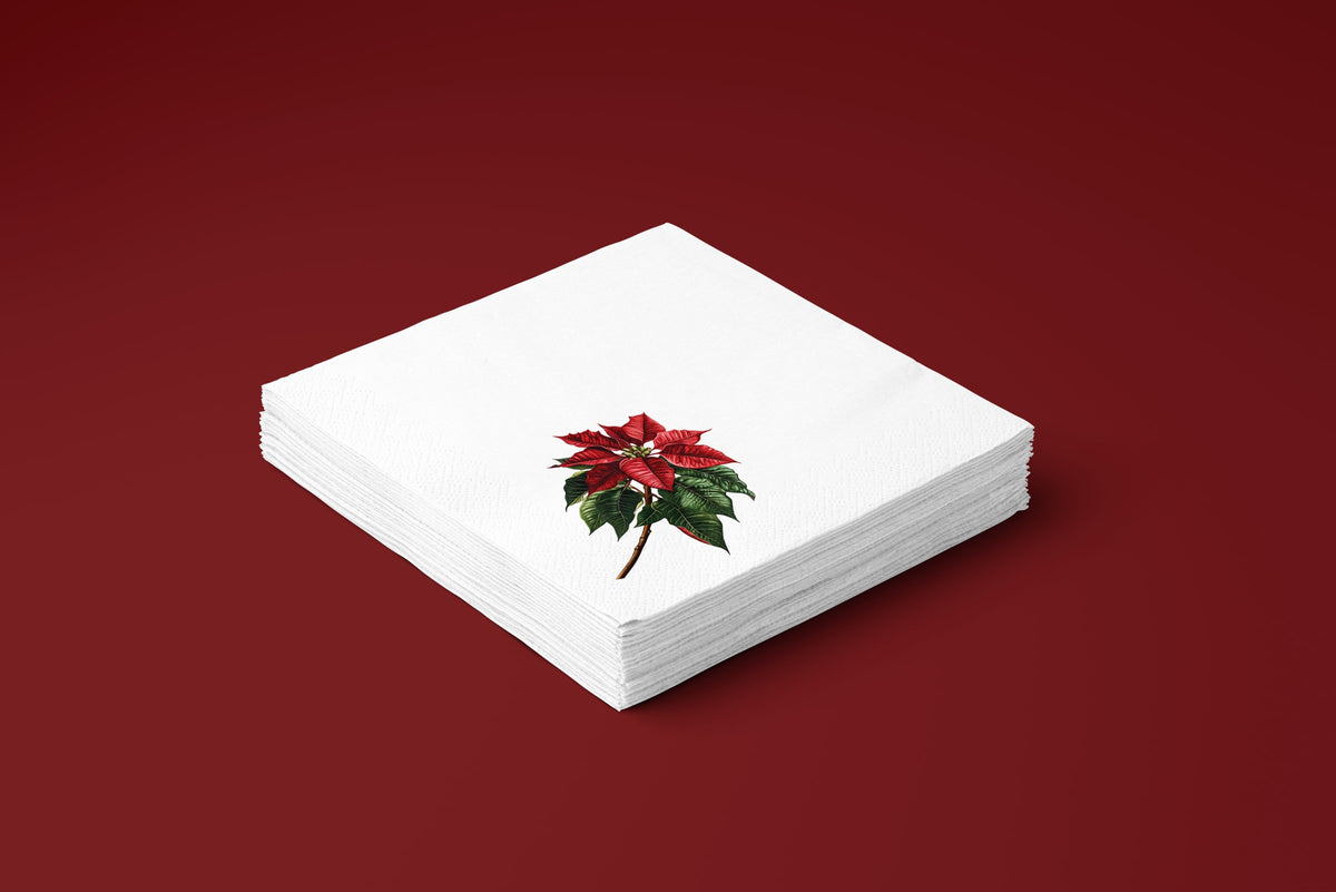 Noël Poinsettia paper napkins on a deep red ground — a stack of napkins