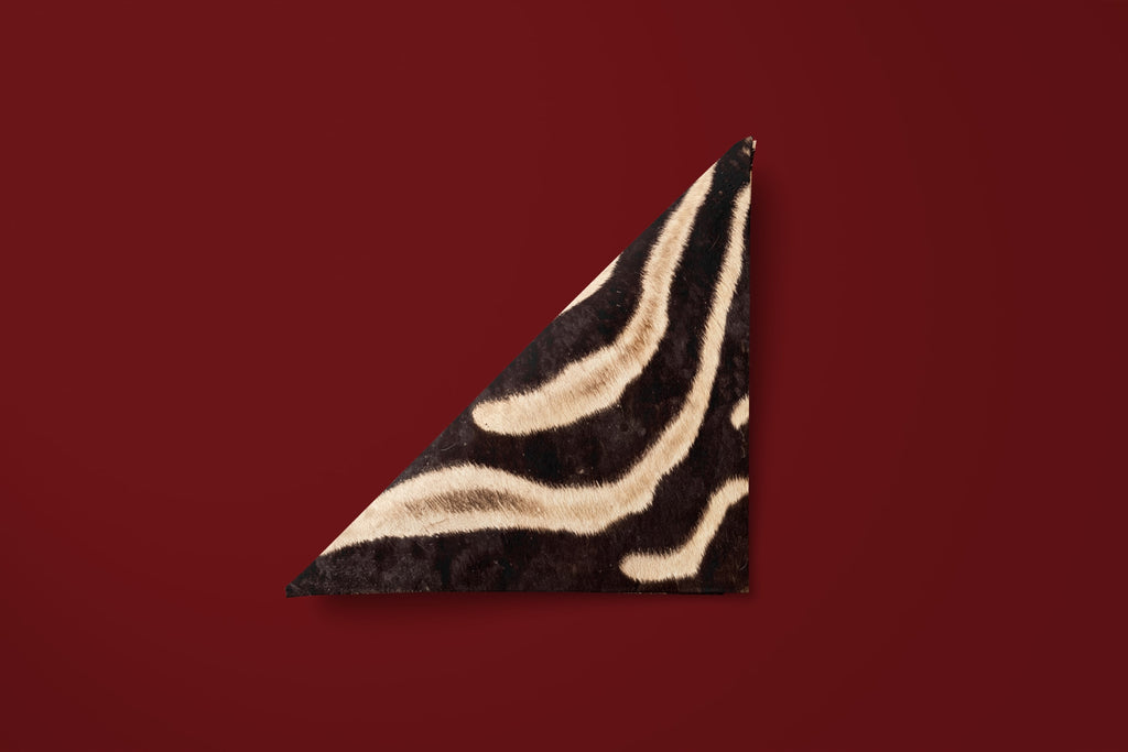 Noël Le Zèbre paper napkin folded into a triangle