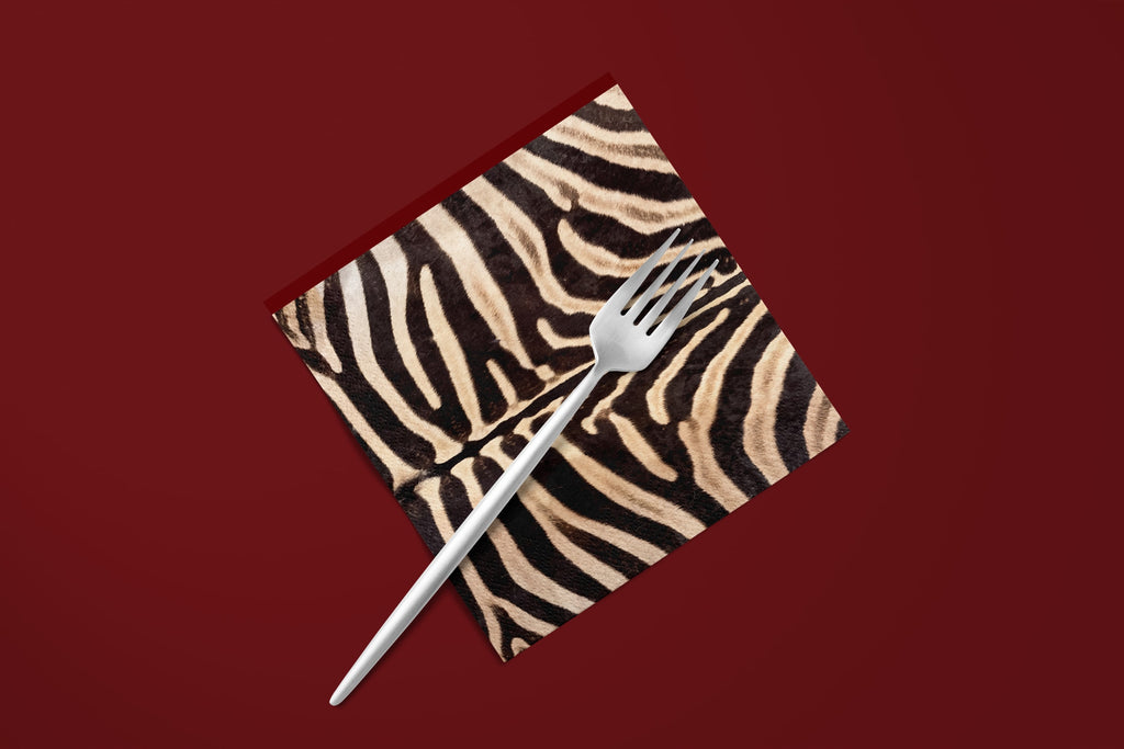 Noël Le Zèbre paper napkin with a silver fork