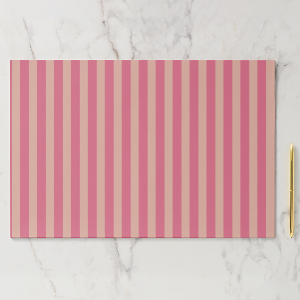 Placemat with pink and beige vertical stripes on a marble surface