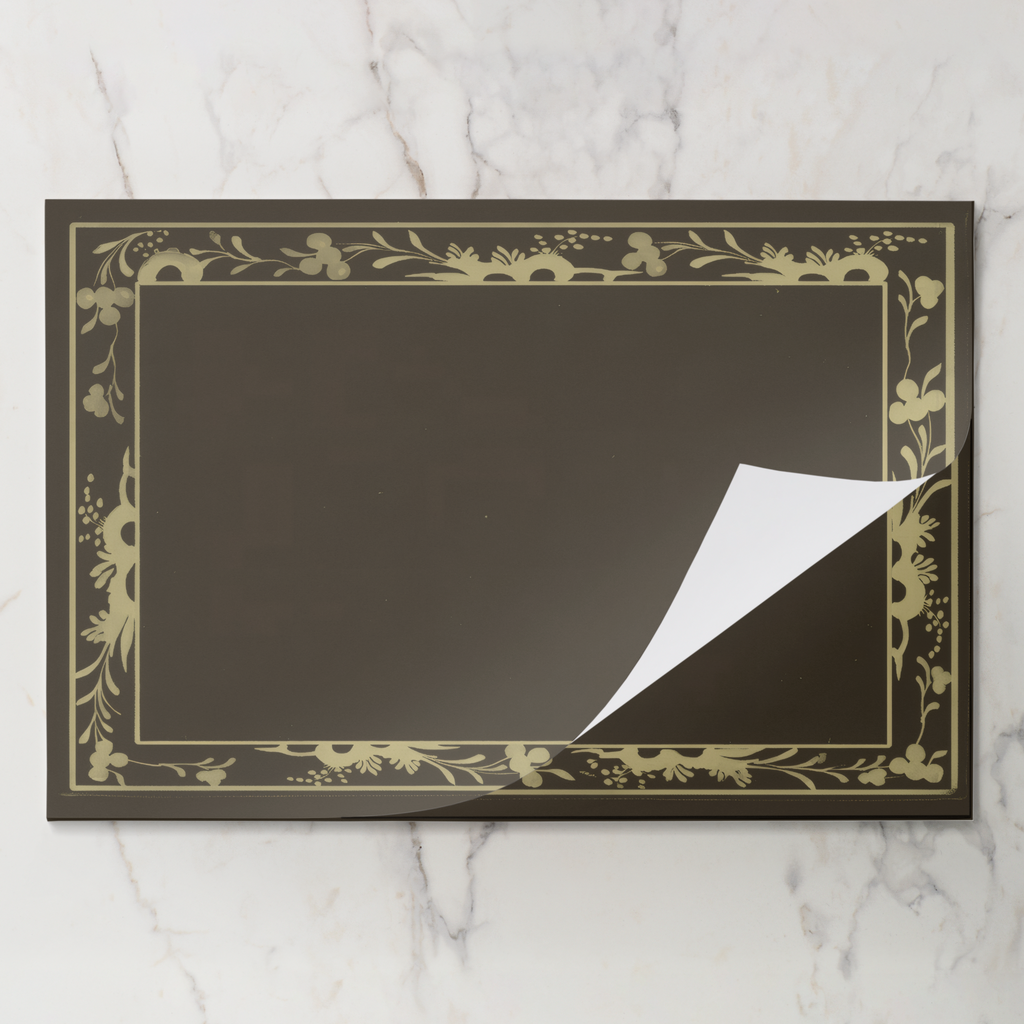 Fawn Bordure placemat pad with the top sheet lifting away