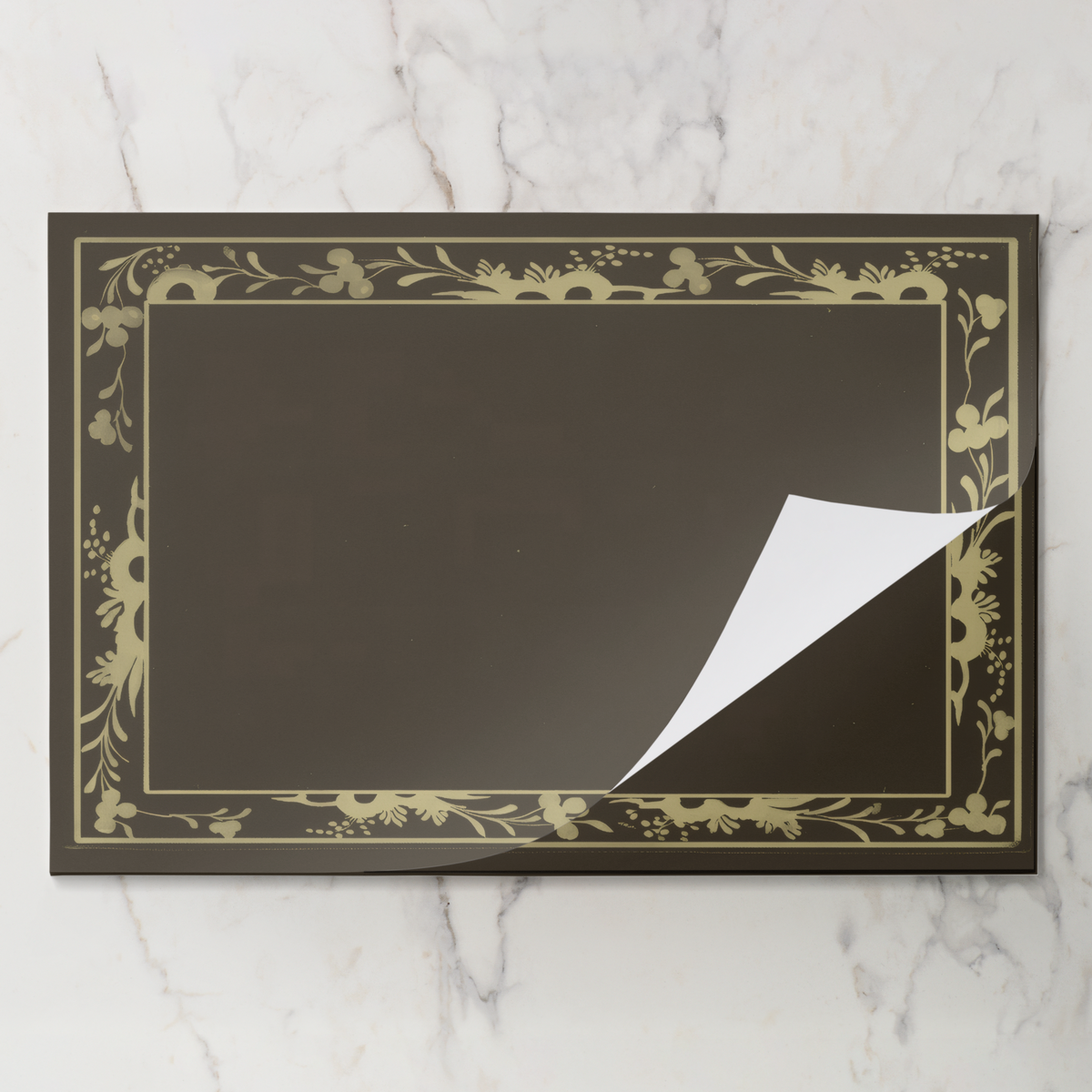 Fawn Bordure placemat pad with the top sheet lifting away