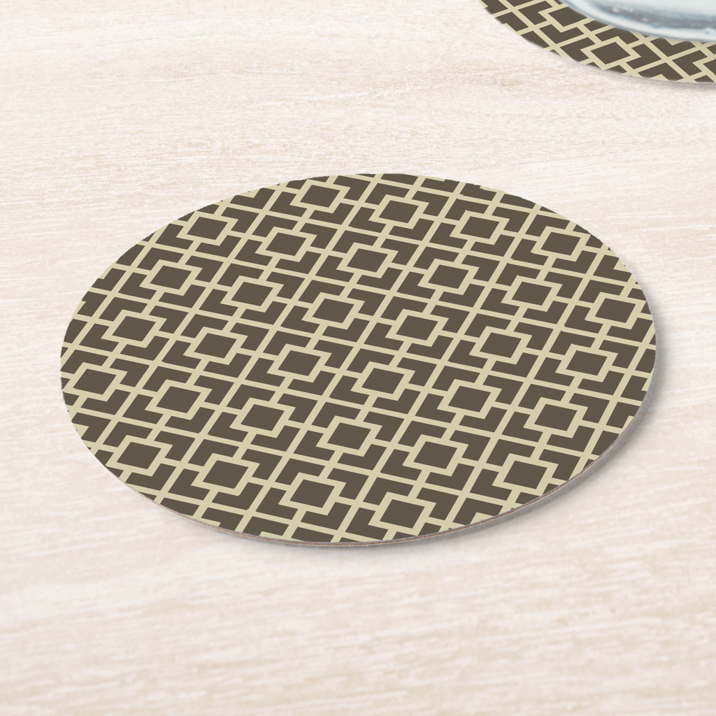 La Chinoiserie Fawn Fretwork paper coasters on pale wood, cream lattice on dark khaki
