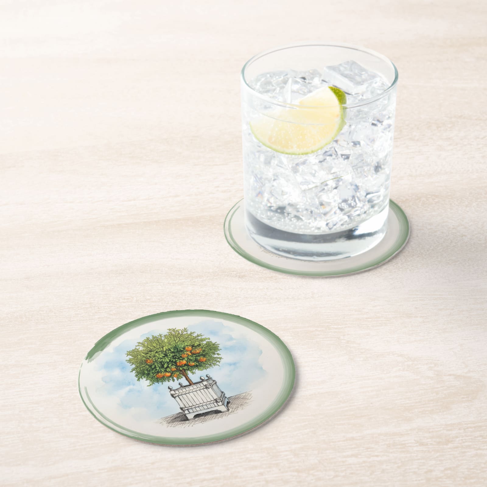 Le Jardin Français Orange Topiary Paper Coasters — in situ