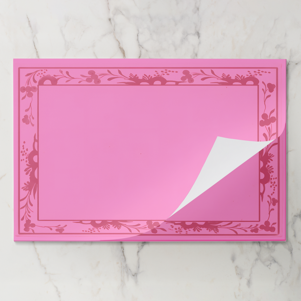 Rouge Bordure placemat pad with the top sheet lifting away