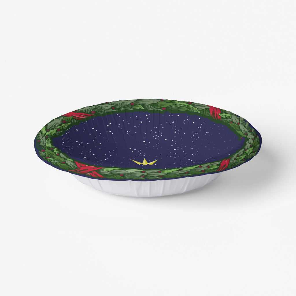 Noël La Nuit Étoilée bowl at an angle, its fluted wall visible — laurel wreath over a starry navy ground
