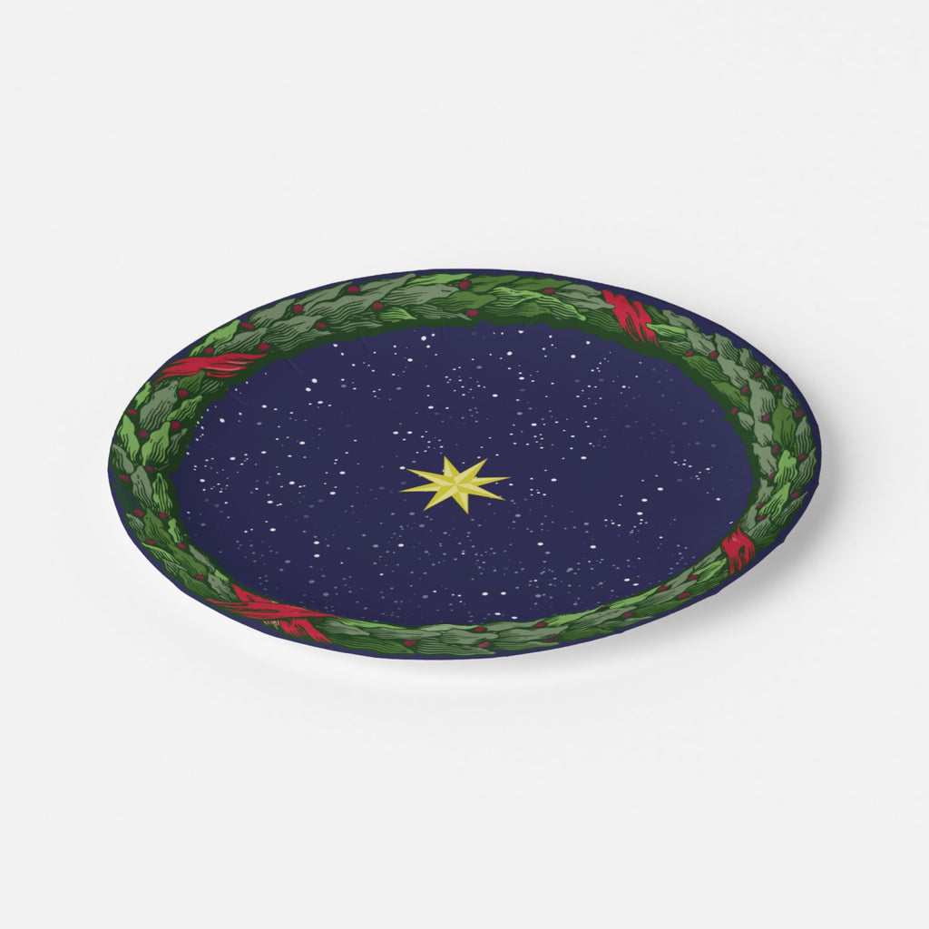 Noël La Nuit Étoilée salad plate at an angle — laurel wreath rim over a starry navy ground