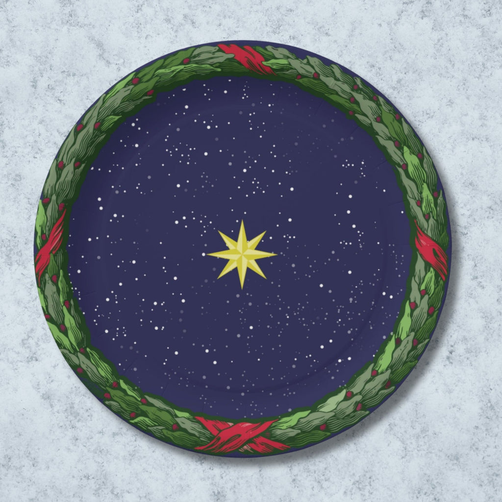 Noël La Nuit Étoilée 9″ dinner plate — gold star on a navy night sky inside a green laurel wreath