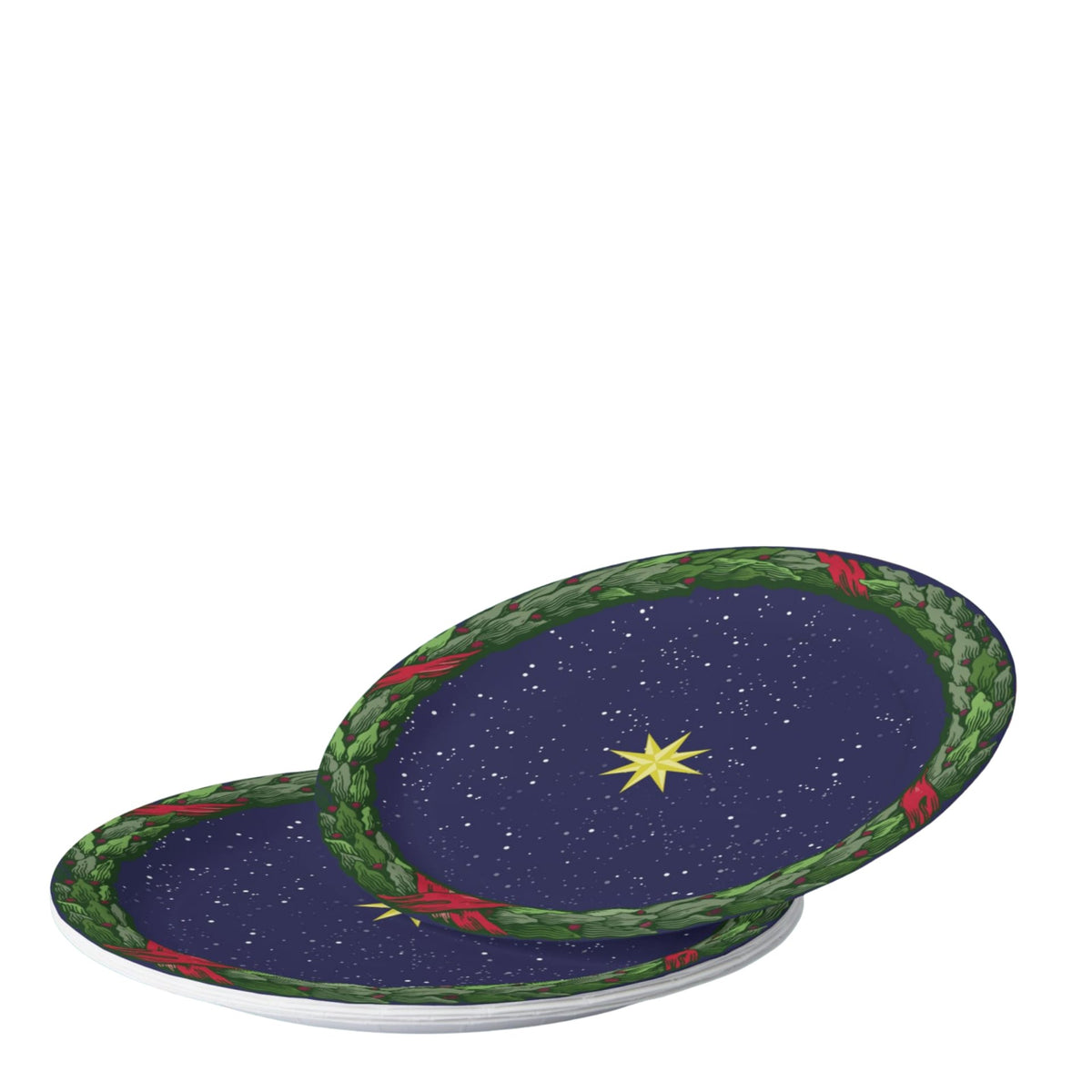 Noël La Nuit Étoilée plates on a set table — gold star on navy inside a green laurel wreath