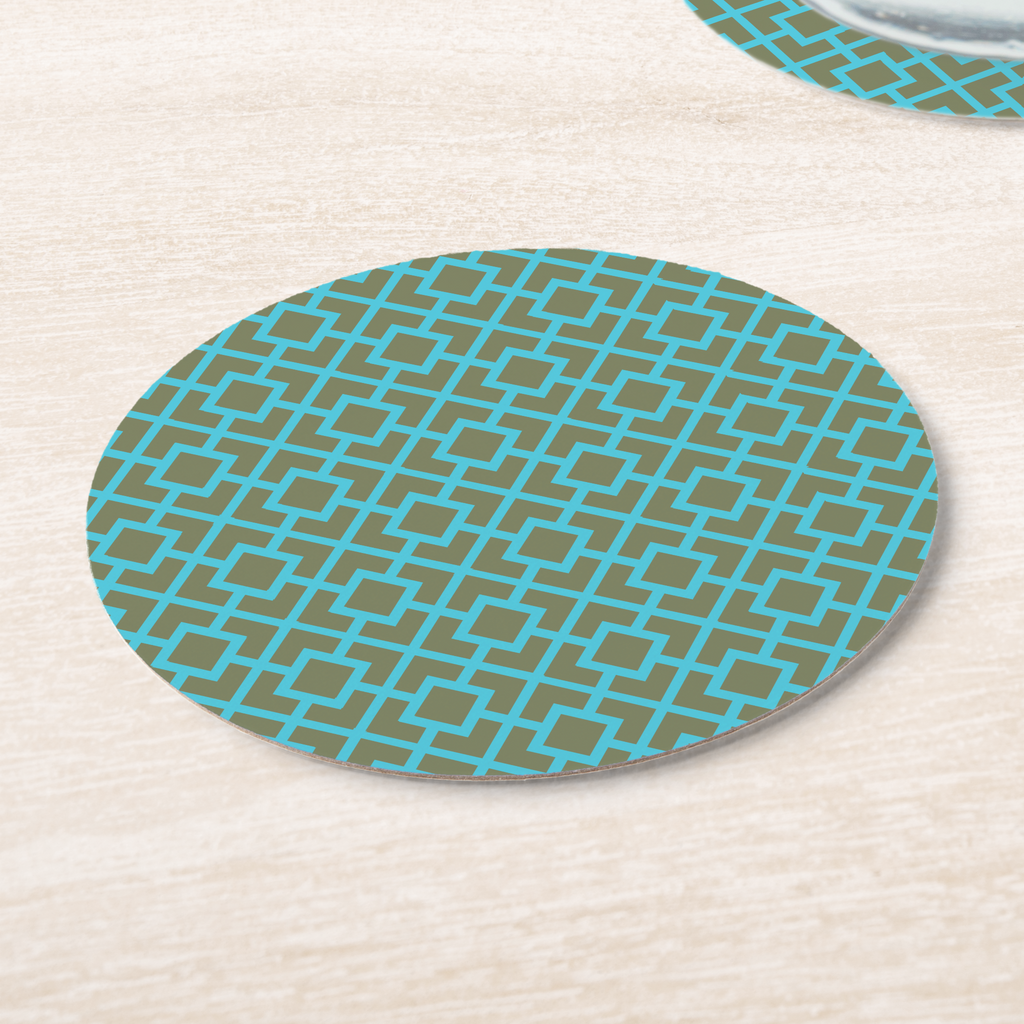 La Chinoiserie Teal Fretwork paper coasters on pale wood, aqua lattice on olive
