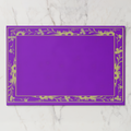 La Chinoiserie Bordure paper placemat in violet — gold engraved floral border framing an open violet centre