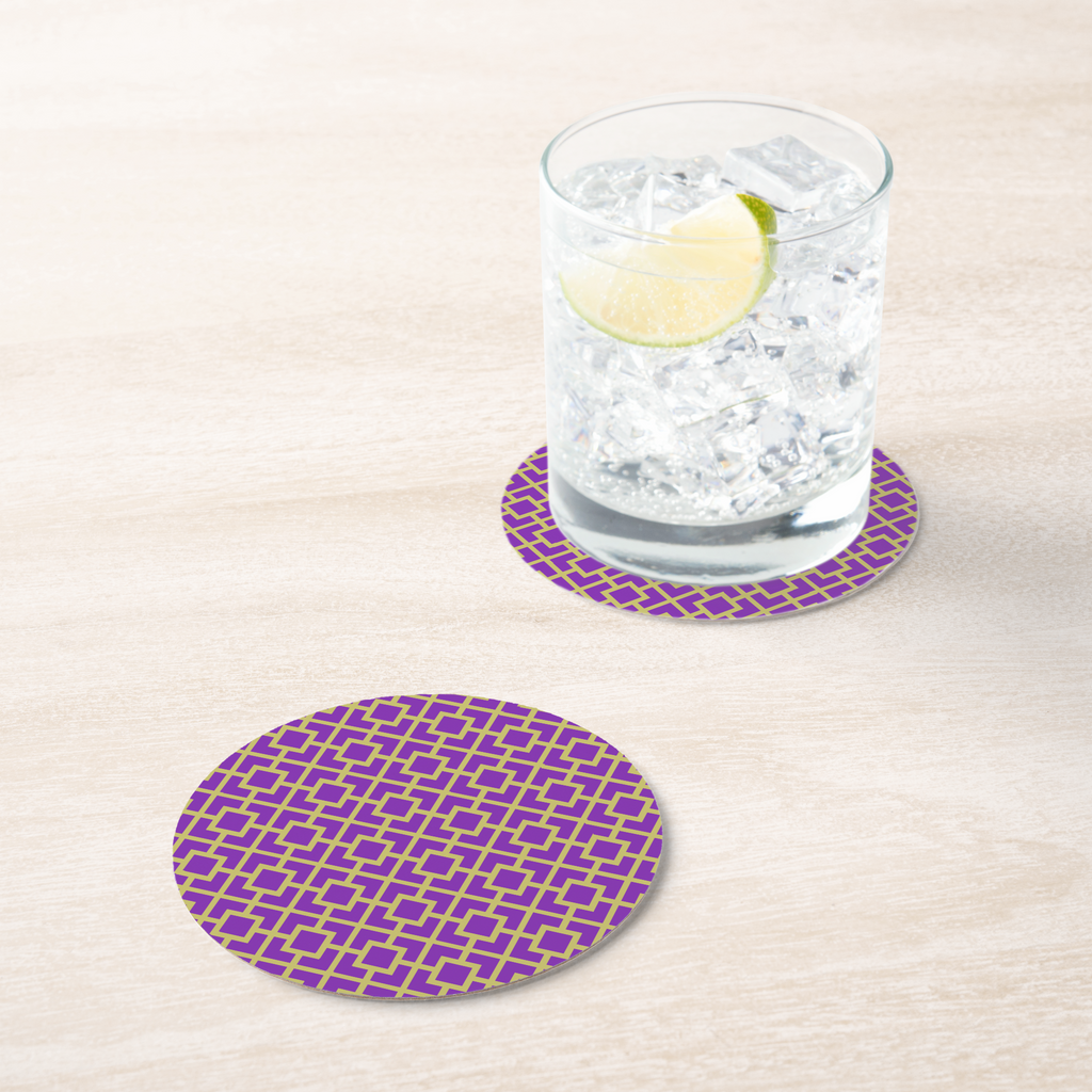 La Chinoiserie Violet Fretwork paper coaster under an iced drink on pale wood