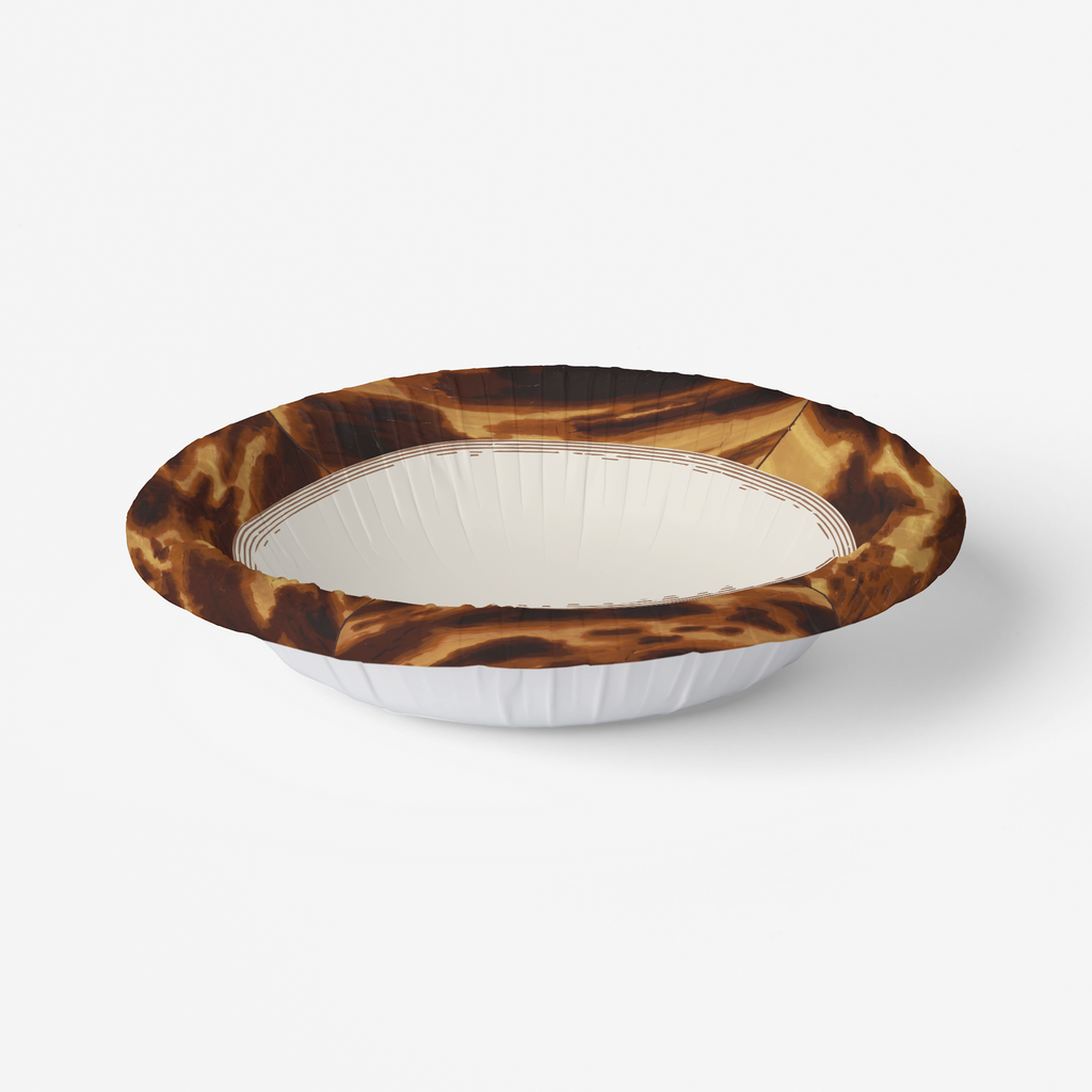Tortoiseshell border paper party bowl at an angle, showing the depth of the fluted sidewall
