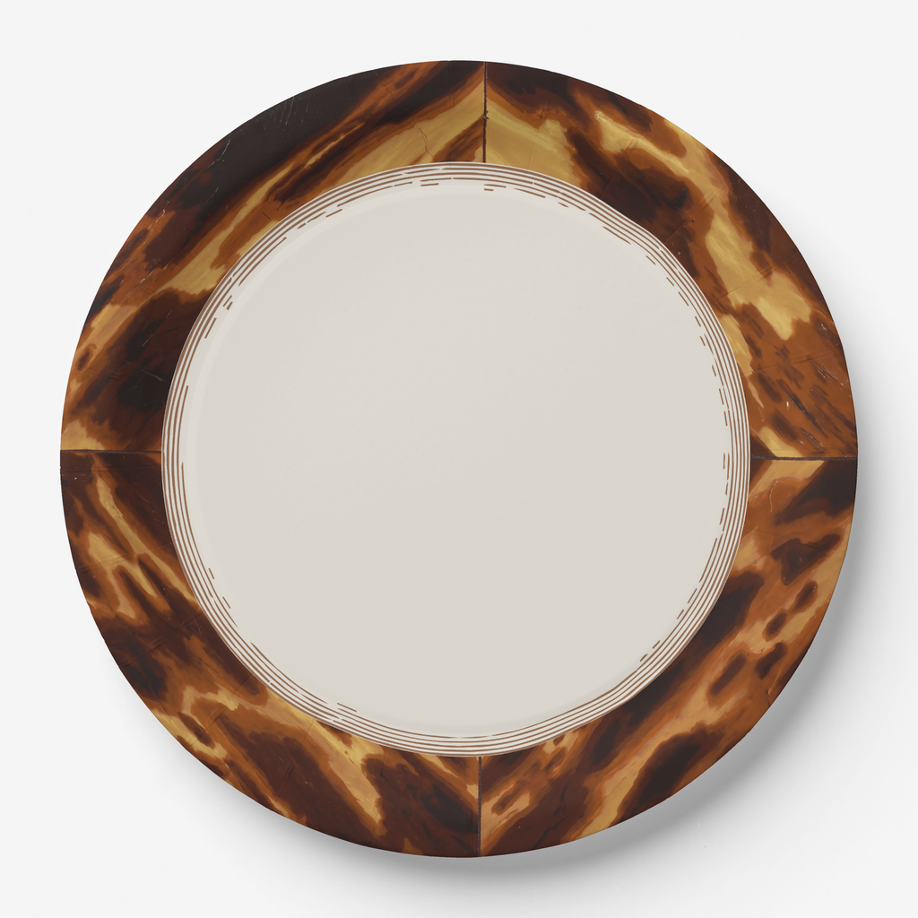 Tortoiseshell border paper party plate — mottled amber and dark brown rim with a plain cream centre and fine concentric rings